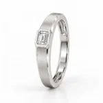 Standing side view of Regal Emerald Moissanite Men's Ring showing its emerald-cut gemstone, silver band and geometric bezel setting.