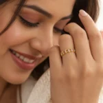 Woman wearing Royal Tiara Marquise Diamond Eternity Ring in yellow gold, featuring sparkling marquise-cut diamonds and an elegant crown-inspired jewellery design.