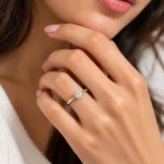 Woman wearing Eternal Twist Moissanite Solitaire Ring in 925 Sterling Silver on ring finger
